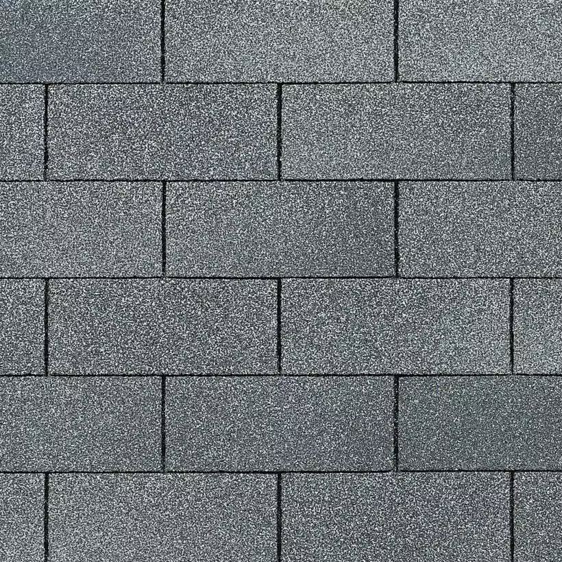 Close-up of classic flat gray 3-tab asphalt shingles