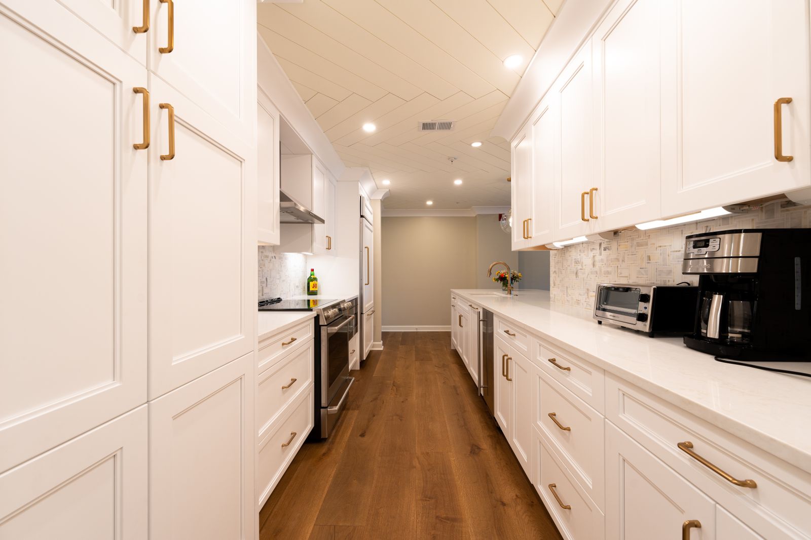 A bright modern kitchen with white cabinets